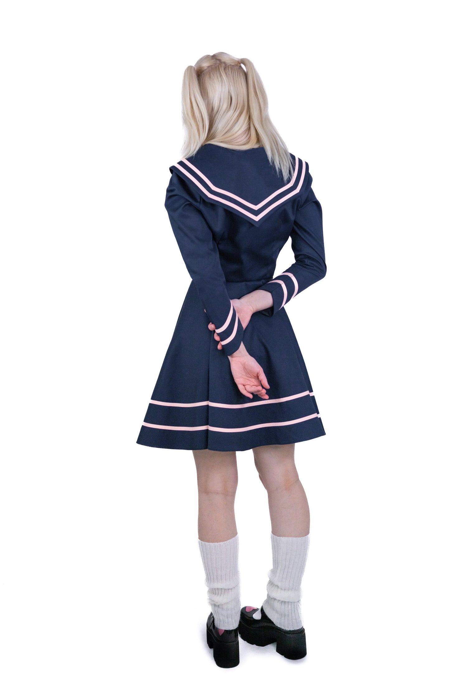 Model wearing alt fashion anime inspired sailor dress - back view